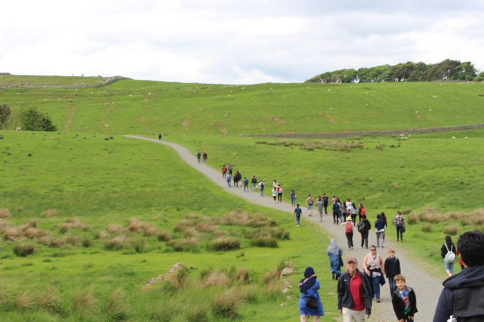 Scholars walk over the hills of Hadrian's Wall