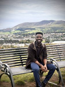 Scholar sitting on a bench in Scotland