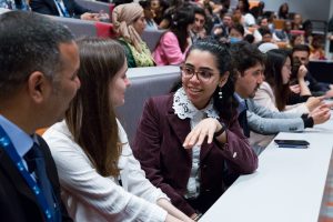 Female Chevening Scholar in conversation during a lecture