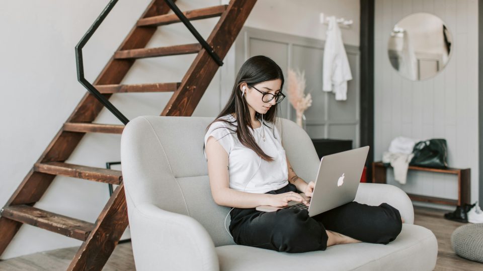 Woman looking at laptop